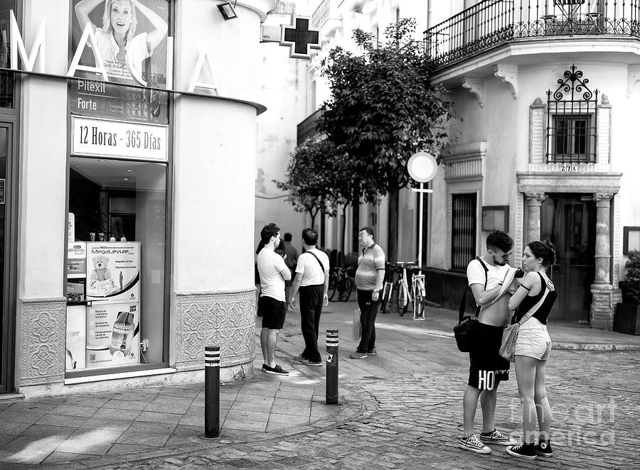 People Helping People in Seville Photograph by John Rizzuto