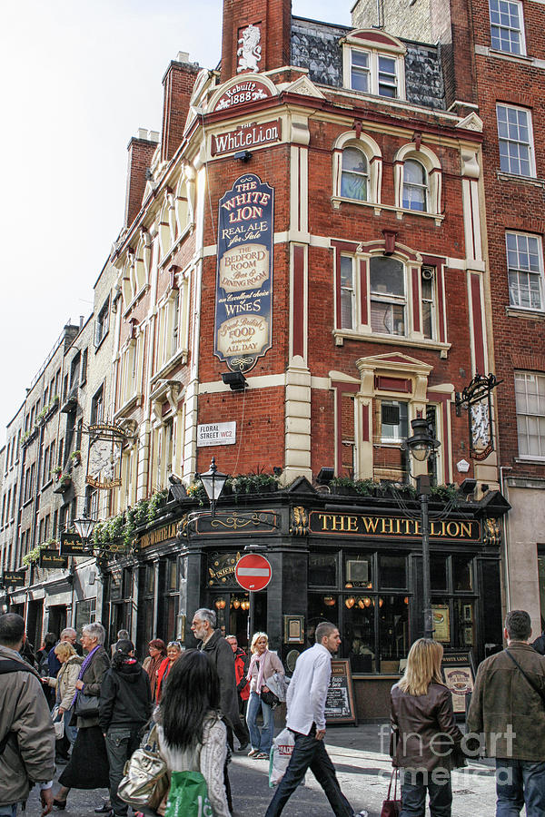 People near a pub in London Photograph by Patricia Hofmeester