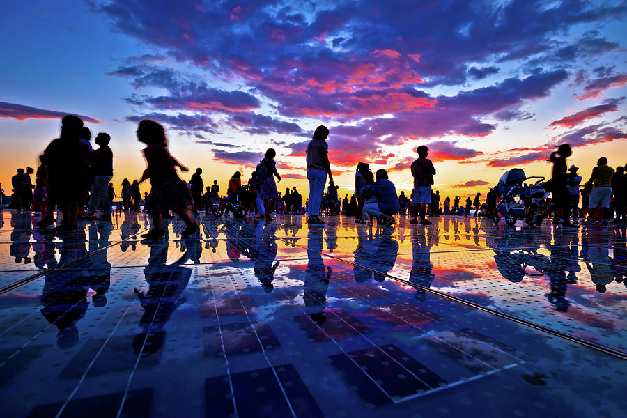 People silhouette on colorful sunset in Zadar Photograph by Brch Photography