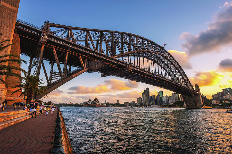 People walk under the Harbour Bridge with view of Sydney skyline Photograph by Miroslav Liska People walk under the Harbour Bridge with view of Sydney skyline Photograph by Miroslav Liska