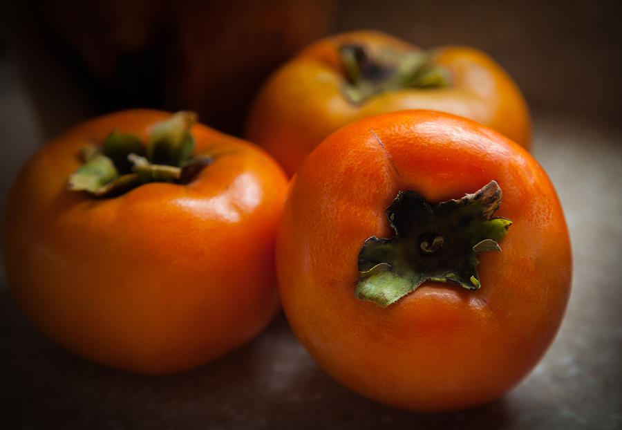 Persimmons Photograph by Karen Wiles
