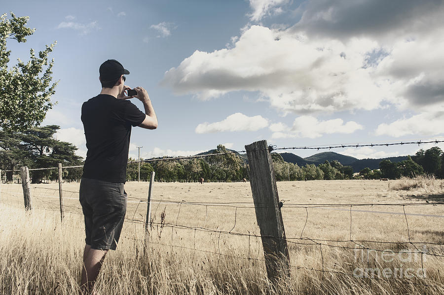 Person taking photograph of a Tasmanian landscape Photograph by Jorgo Photography