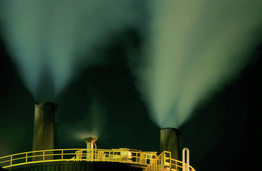 Air Pollution Photograph - Petroleum refinery chimneys at night by Sami Sarkis