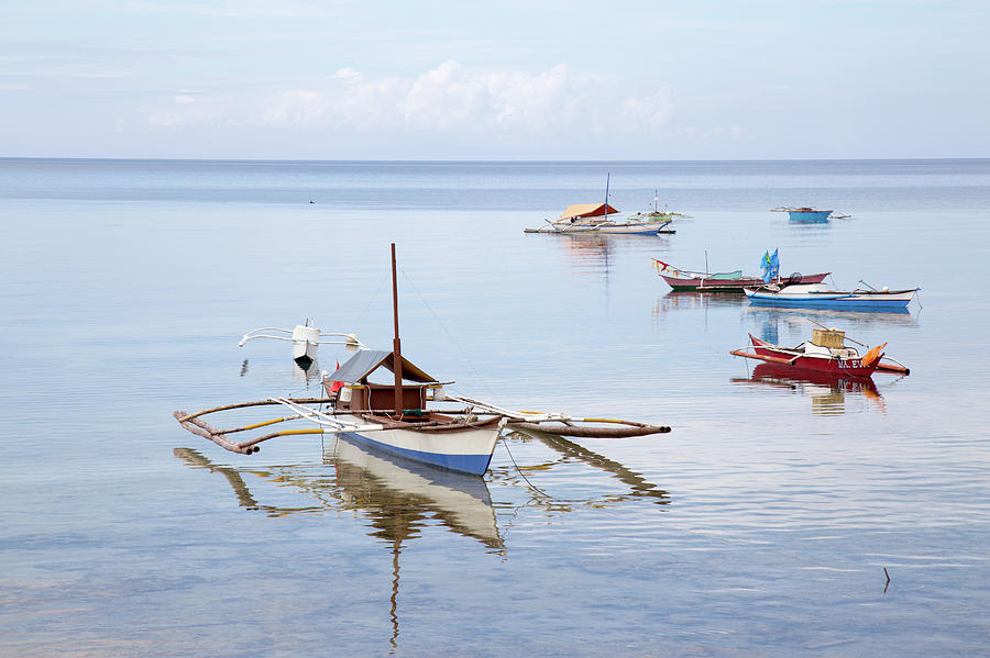 Philippines fishing boats reflection by Robert Mcgillivray