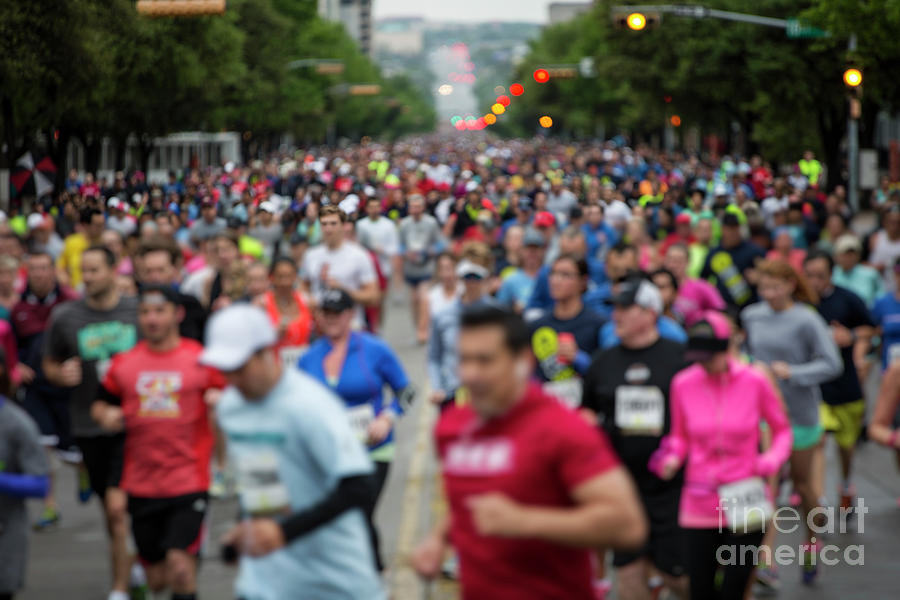 Austin Photograph - Photo of thousands of runners on Congress Ave at the the Cap 10K in downtown Austin Texas with in camera motion blur by Dan Herron