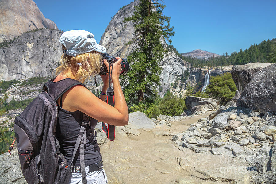 Photographer in Yosemite waterfalls Photograph by Benny Marty