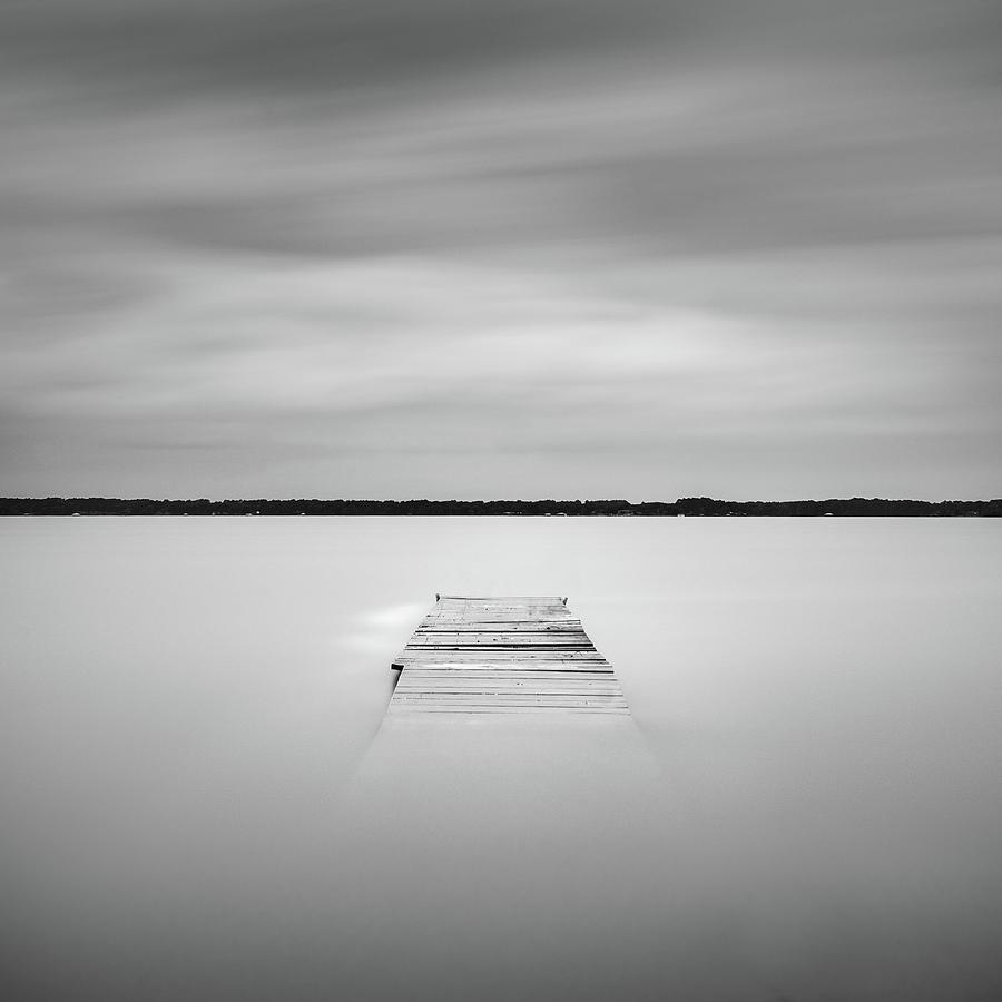 Black And White Photograph - Pier Sinking Into The Water by Todd Aaron