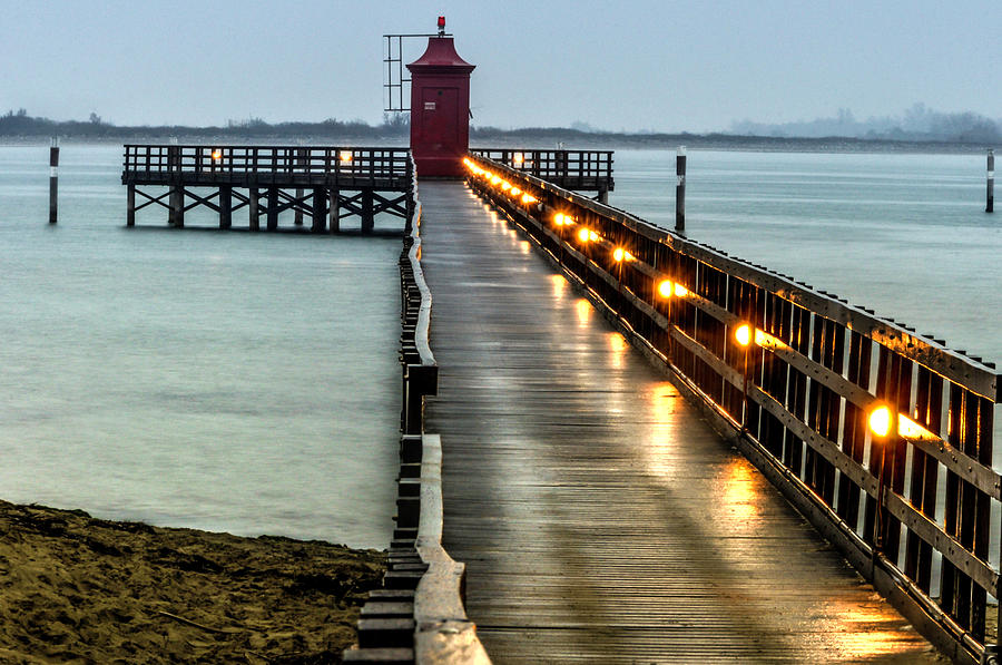 Pier with lighthouse Photograph by Wolfgang Stocker