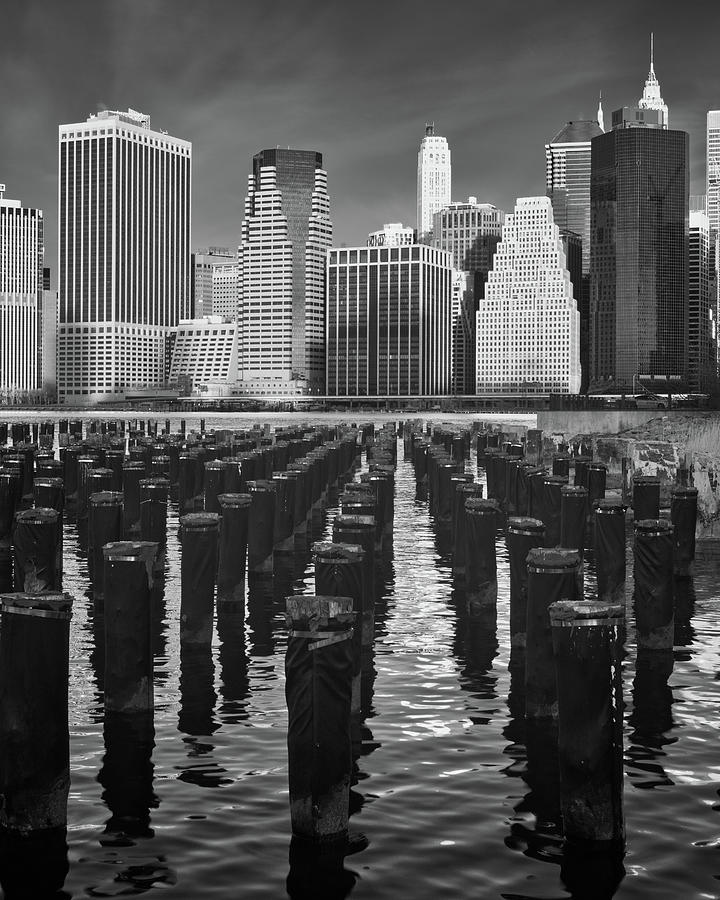 Pilings and the New York City Skyline Photograph by Jerry Fornarotto