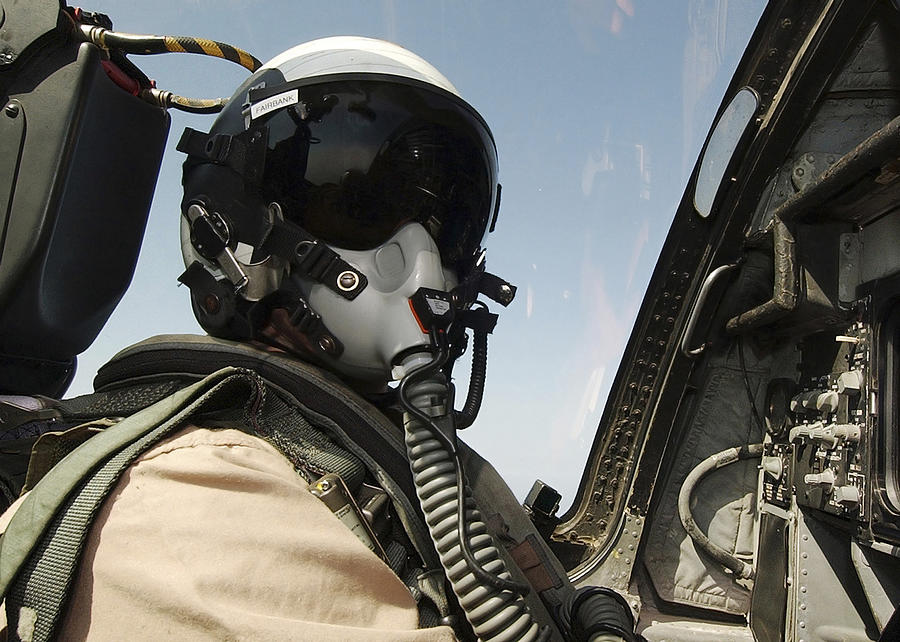 Horizontal Photograph - Pilot Performs A Flight Mission In An by Stocktrek Images