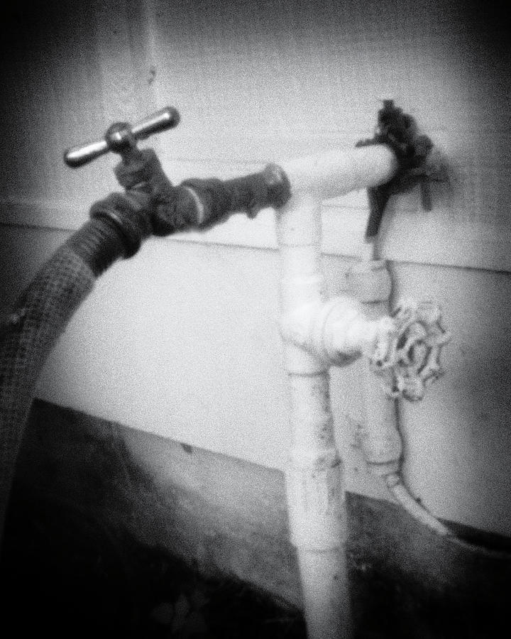 Pinhole water spigot 3154 Photograph by Rudy Umans