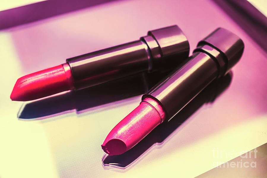 Pink and rouge lipsticks on table Photograph by Jorgo Photography