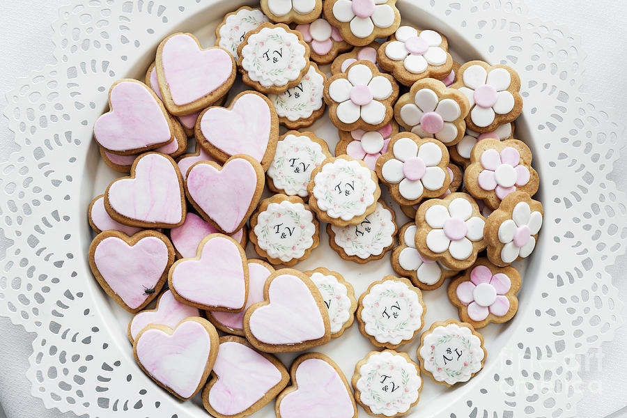Pink And White Glazed Cookie Biscuits On Tray Photograph by JM Travel Photography