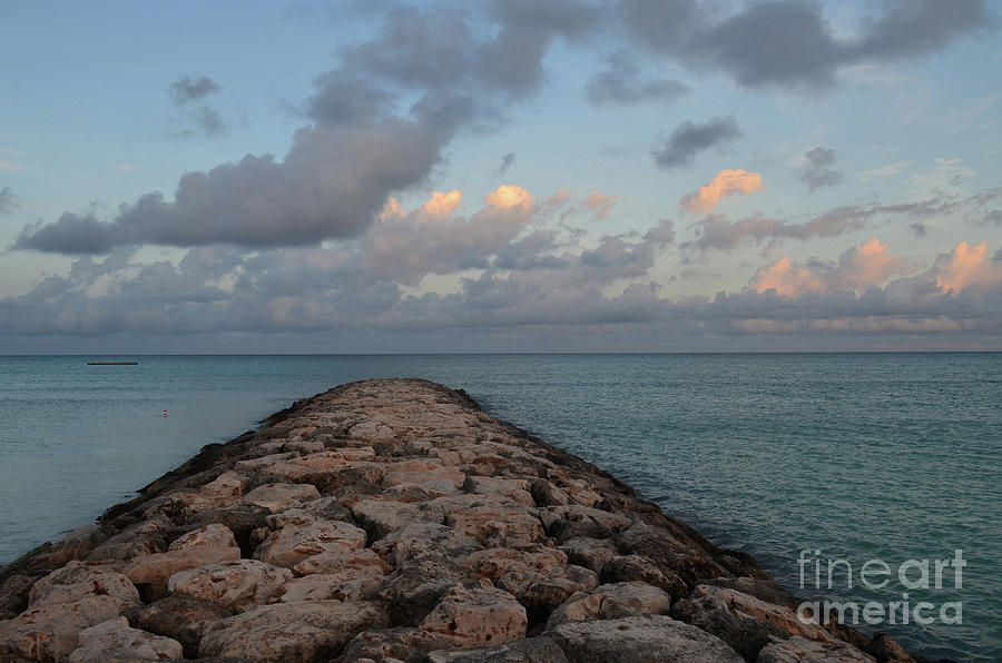 Pink Clouds Over a Rock Jetty Coastal Aruba Photograph by DejaVu Designs