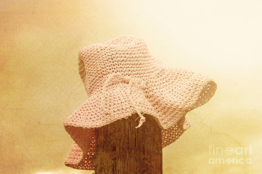 Pink girls hat on farmyard fence post Photograph by Jorgo Photography