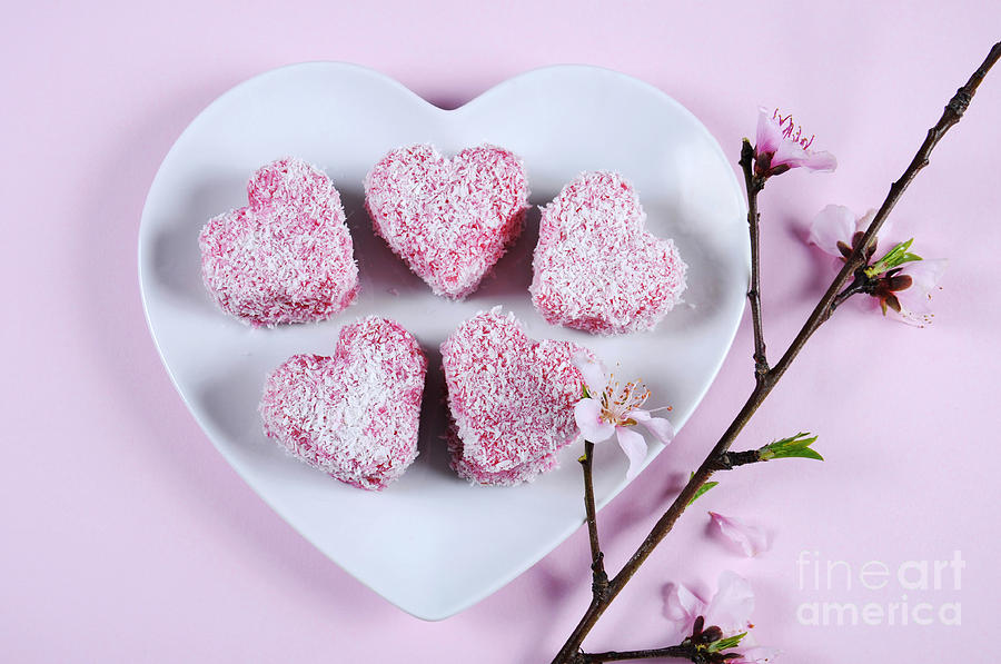 Pink heart shape small lamington cakes Photograph by Milleflore Images