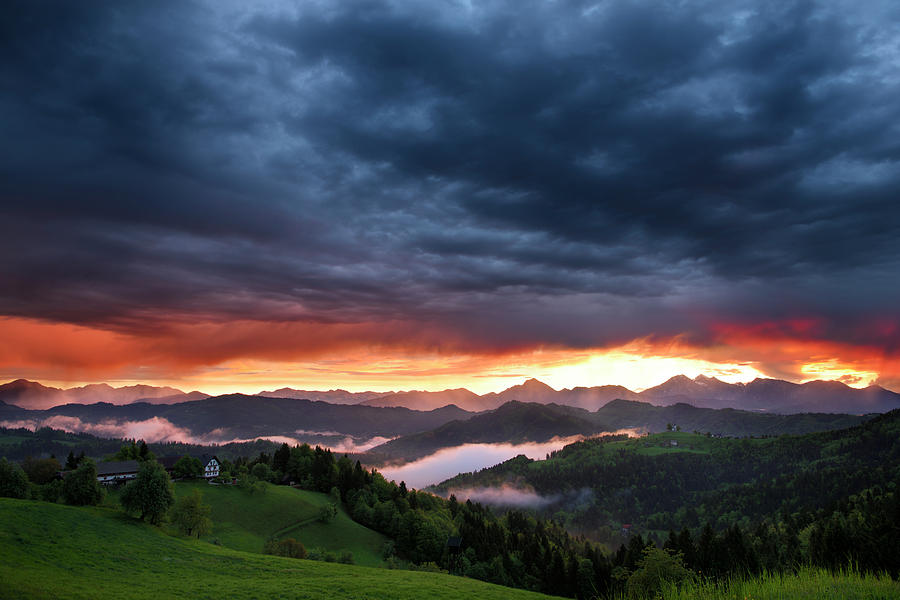 Mountain Photograph - Pink sunrise and blue clouds in the mountains of Kamnik Savinja  by Reimar Gaertner