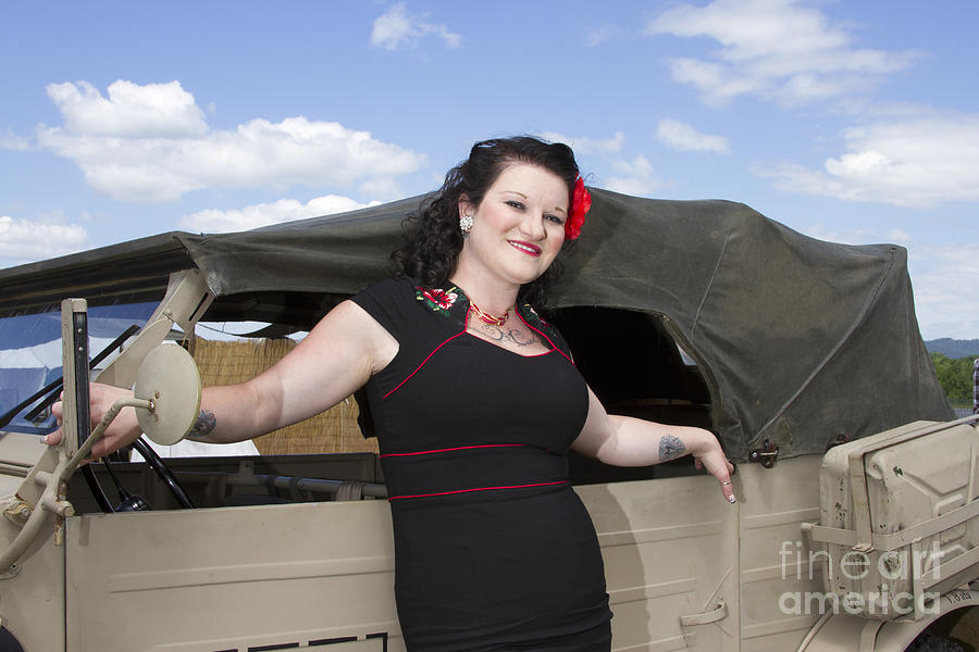PinUp leaning on Jeep Photograph by Karen Foley
