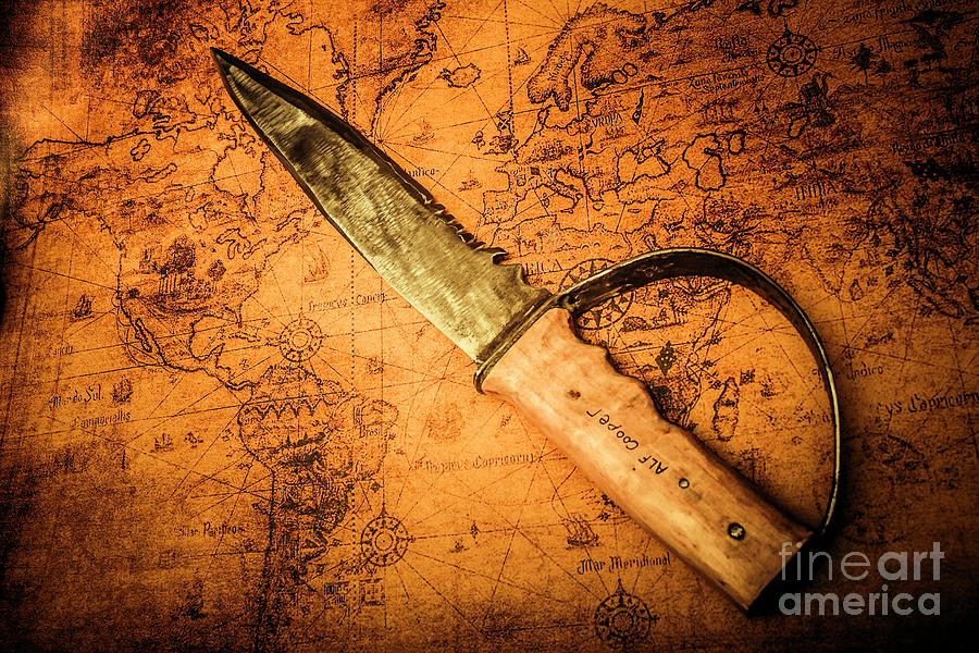 Pirate sword on buried treasure map Photograph by Jorgo Photography