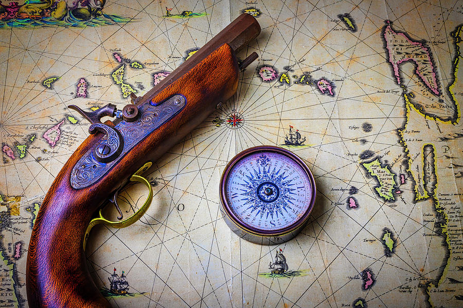 Pistole And Compass On Old Map Photograph by Garry Gay