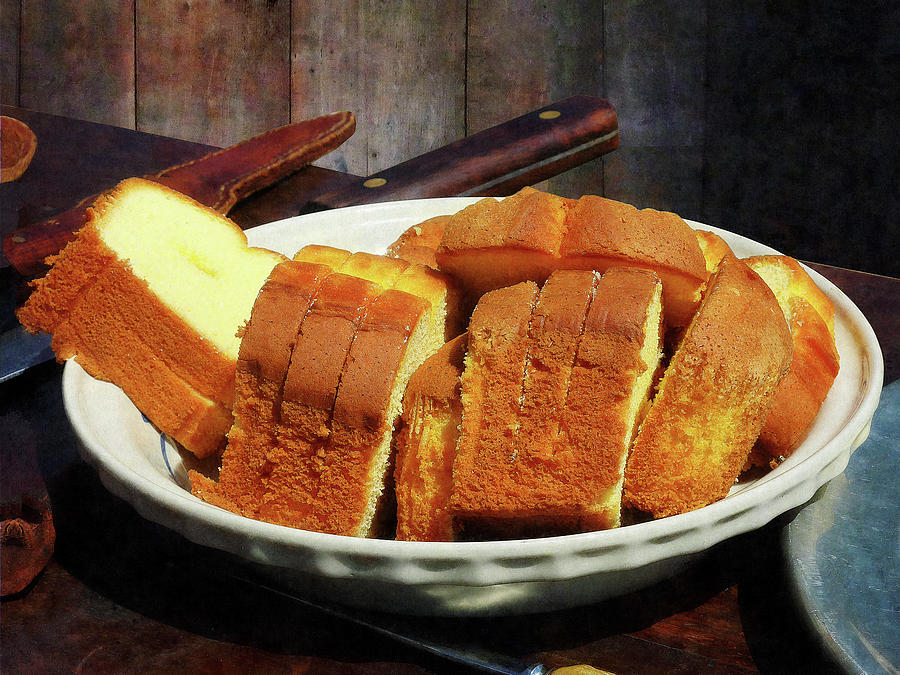 Plate With Sliced Bread and Knives Photograph by Susan Savad