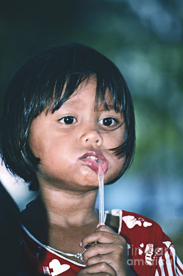 Portrait Photograph - Playful Little Girl in Thailand by Heiko Koehrer-Wagner
