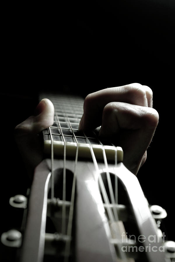 Playing guitar Photograph by Andreas Berheide