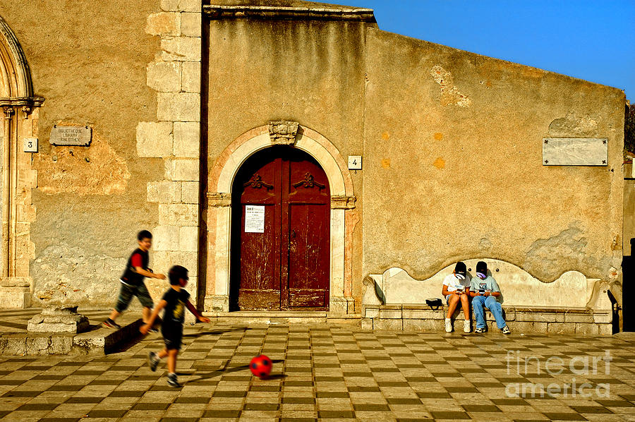 Playing in Taormina Photograph by Silvia Ganora