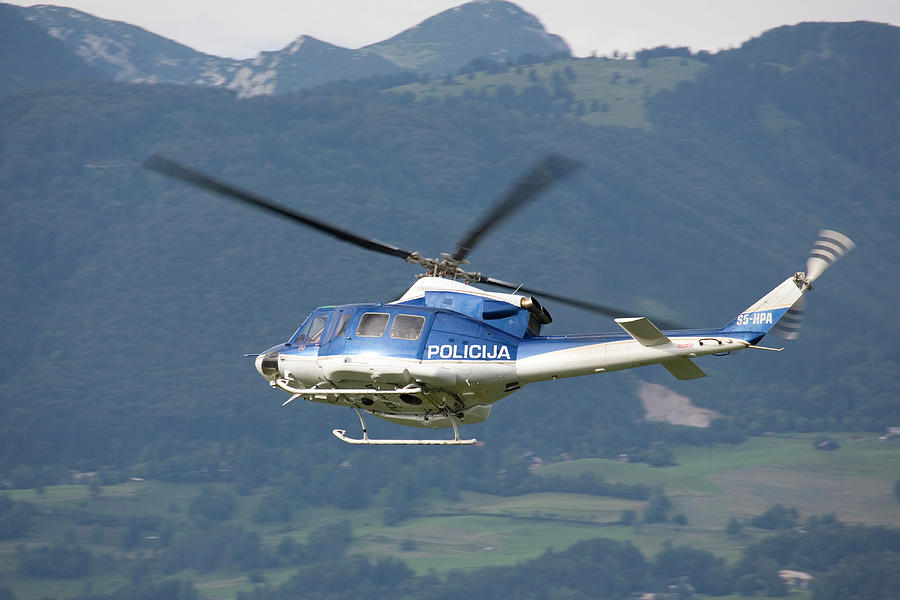 Police helicopter patrolling Photograph by Ian Middleton