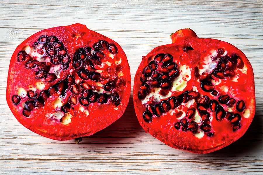 Pomegranate Cut In Half Photograph by Garry Gay