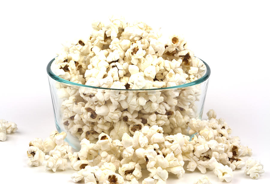 Popcorn Photograph - Popcorn in glass bowl by Blink Images