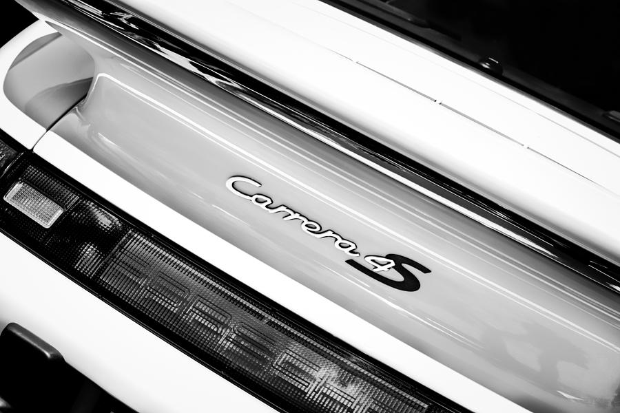 Black And White Photograph - Porsche Carrera 4S Taillight Emblem -0205bw by Jill Reger