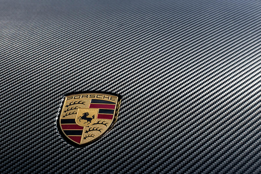 Porsche logo on carbon front boot lid Photograph by 2bhappy4ever
