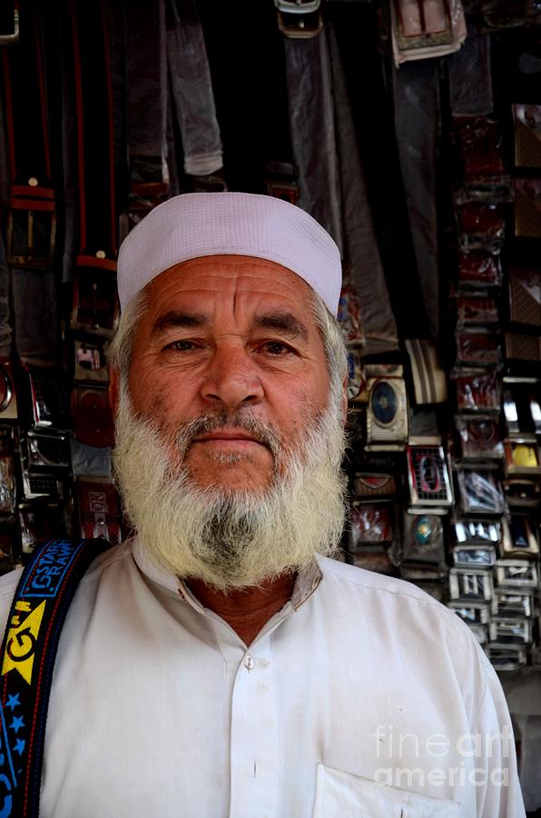 Portrait of Pashtun Pakistani man posing outside belt shop Empress Market Karachi Photograph by Imran Ahmed