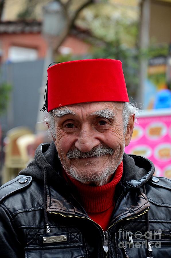 Turkey Photograph - Portrait of Turkish senior wears Fez and leather jacket smiles Istanbul Turkey by Imran Ahmed