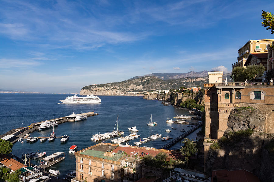 Postcard from Sorrento Italy - the Harbor the Boats and the Famous Clifftop Hotels Photograph by Georgia Mizuleva