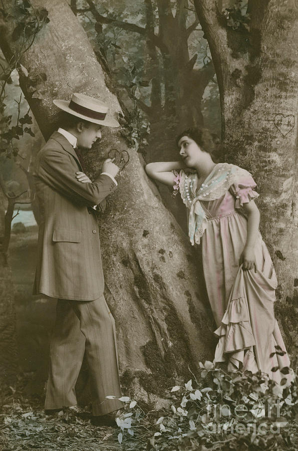 Postcard of lovers carving a heart on a tree, 1913   vintage photo Photograph by French School