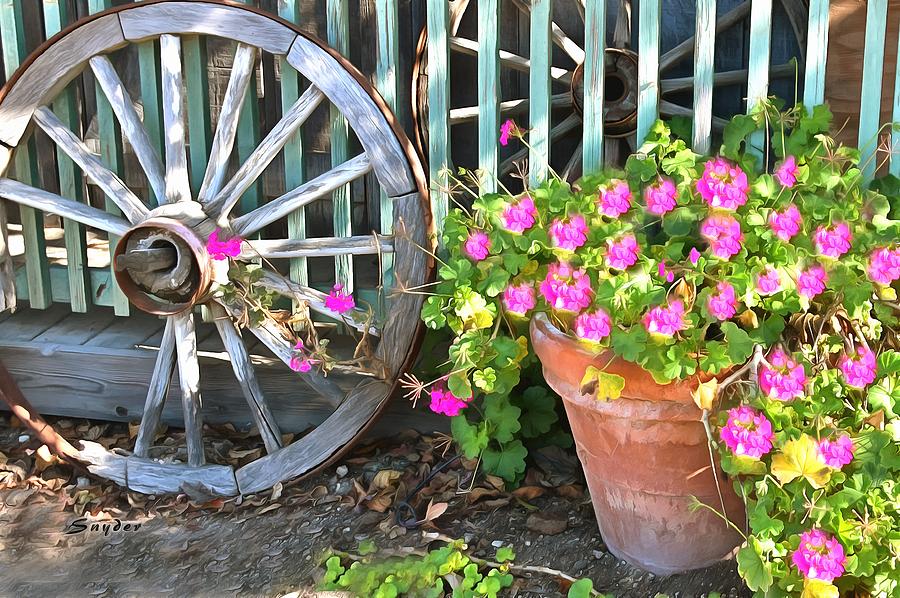 Potted Plant and a Wagon Wheel Photograph by Floyd Snyder
