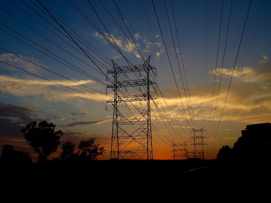 Power Sunset Photograph by Chris Bavelles