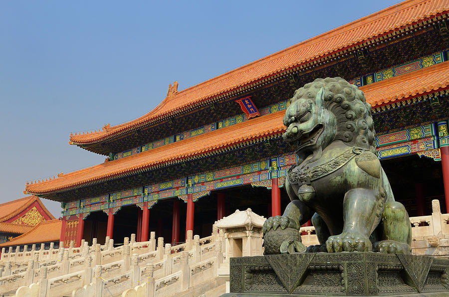 Powerful bronze male lion at the Gate of Supreme Harmony in the  Photograph by Reimar Gaertner
