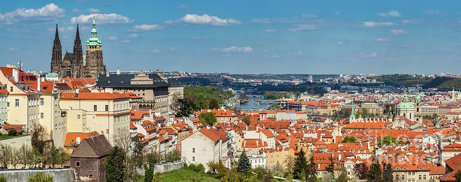 Prague, Czech Republic panorama. St. Vitus Cathedral over old town red roofs. Photograph by Michal Bednarek