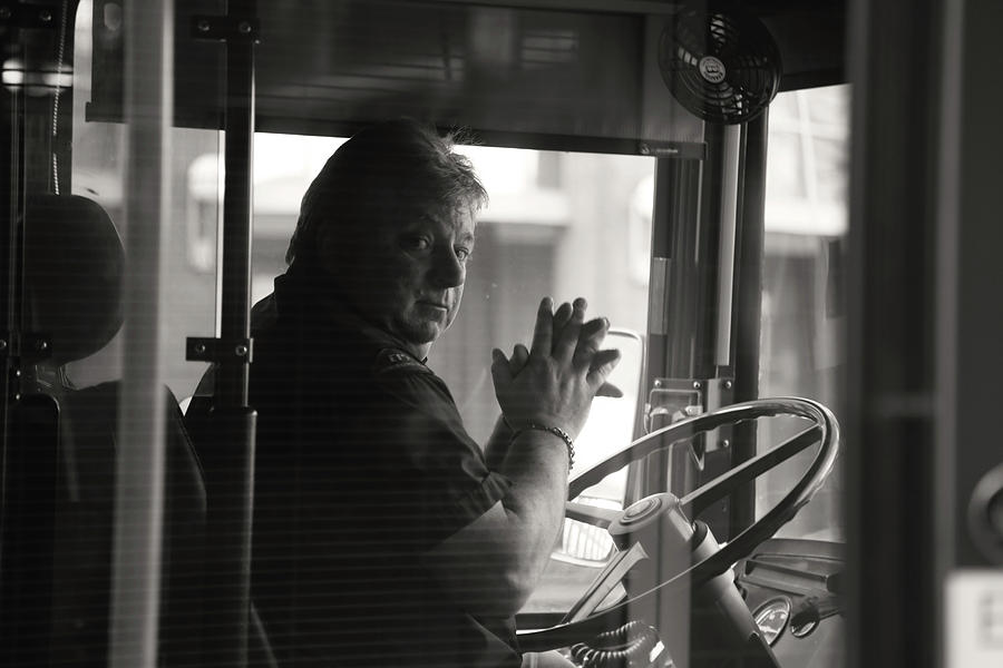 Praying bus driver  Photograph by J C
