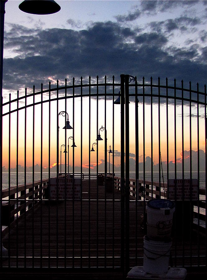 Pre-Sunrise at the Daytona Beach Fishing Pier Gate Photograph by Christopher Mercer