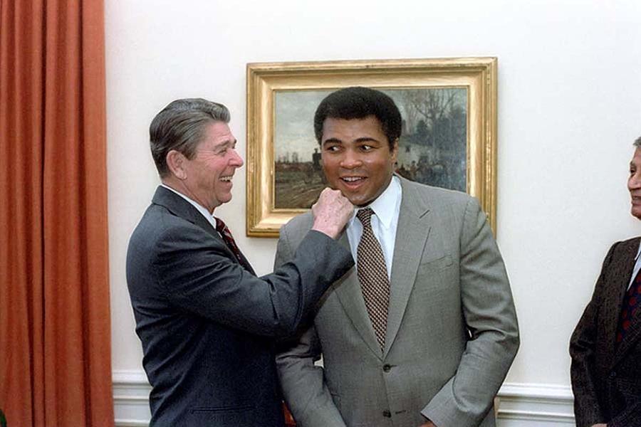 Politician Photograph - President Reagan Punching Muhammad Ali by Everett