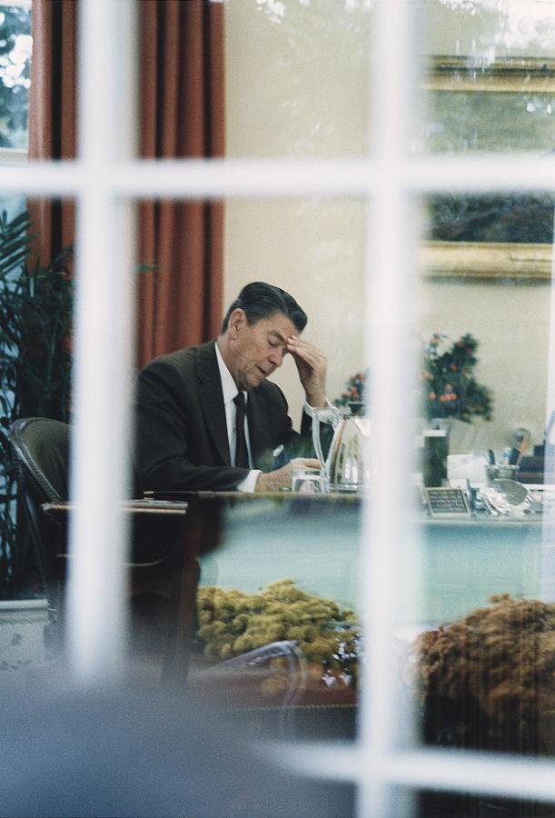 History Photograph - President Reagan Working In The Oval by Everett