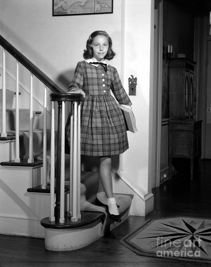 Preteen Girl Coming Down Stairs, C.1950s Photograph by Debrocke/ClassicStock