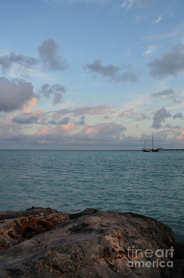 Pretty Pink Tipped Clouds Over a Jetty in Aruba Photograph by DejaVu Designs