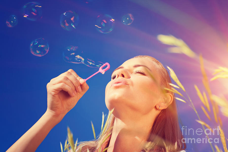 Pretty woman blowing soap bubbles Photograph by Anna Om