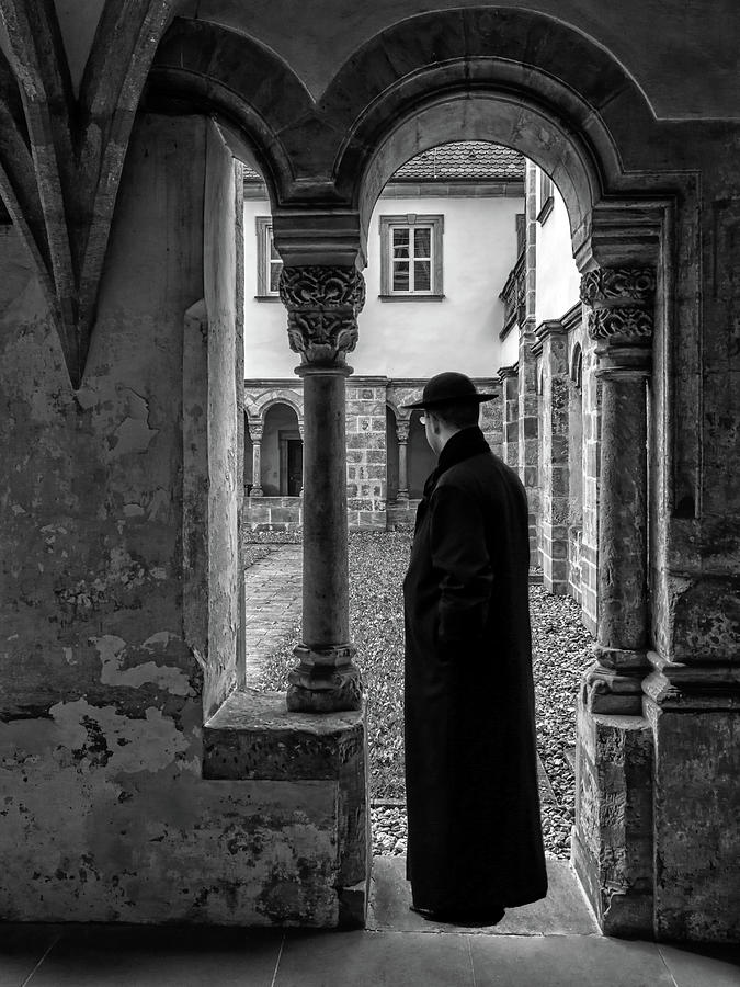 Priest Under Archway Photograph by Carlos Diaz