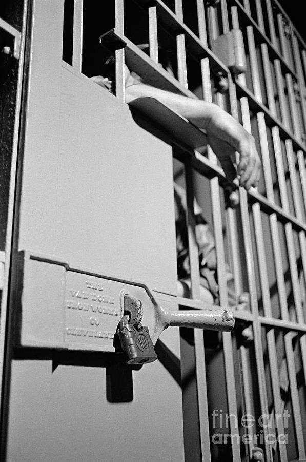Prisoners Hand Through Bars, C.1960s Photograph by H. Armstrong Roberts/ClassicStock
